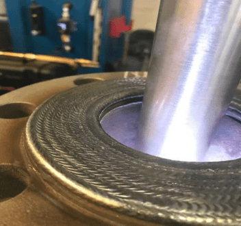 A close-up of an aluminum machine part.
